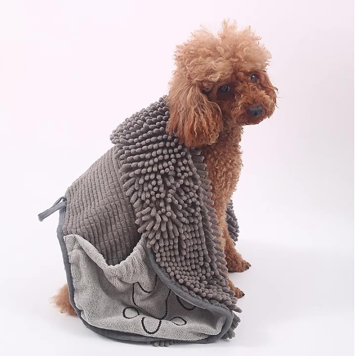 Small brown dog wrapped in a grey chenille pet drying towel